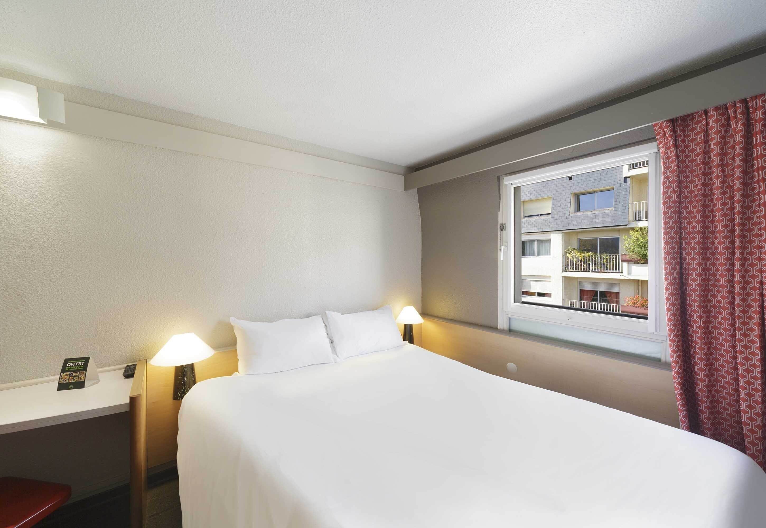 premium bedding, desk, laptop workspace, blackout curtains