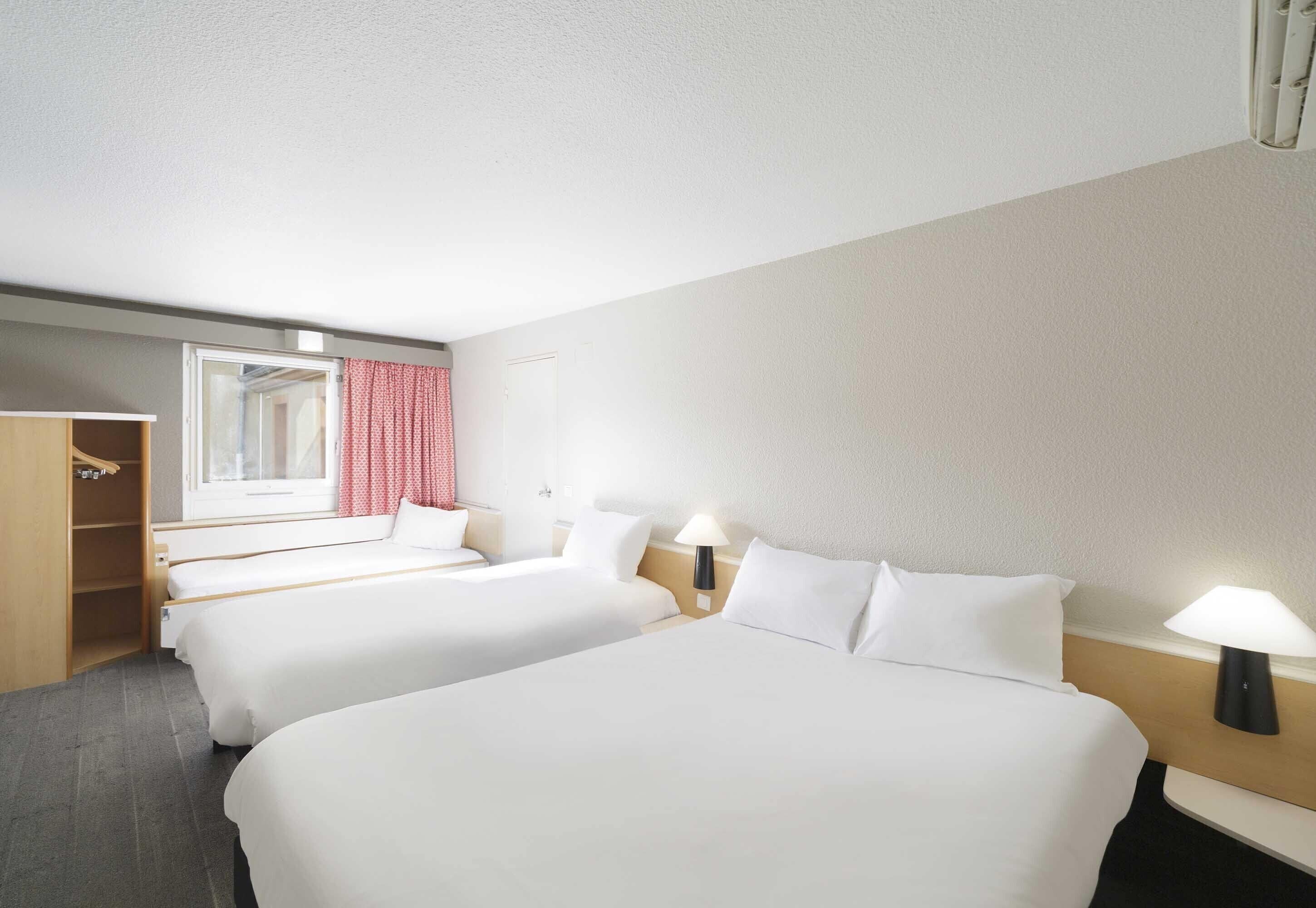 Standard Quadruple Room, Non Smoking | Premium bedding, desk, laptop workspace, blackout curtains