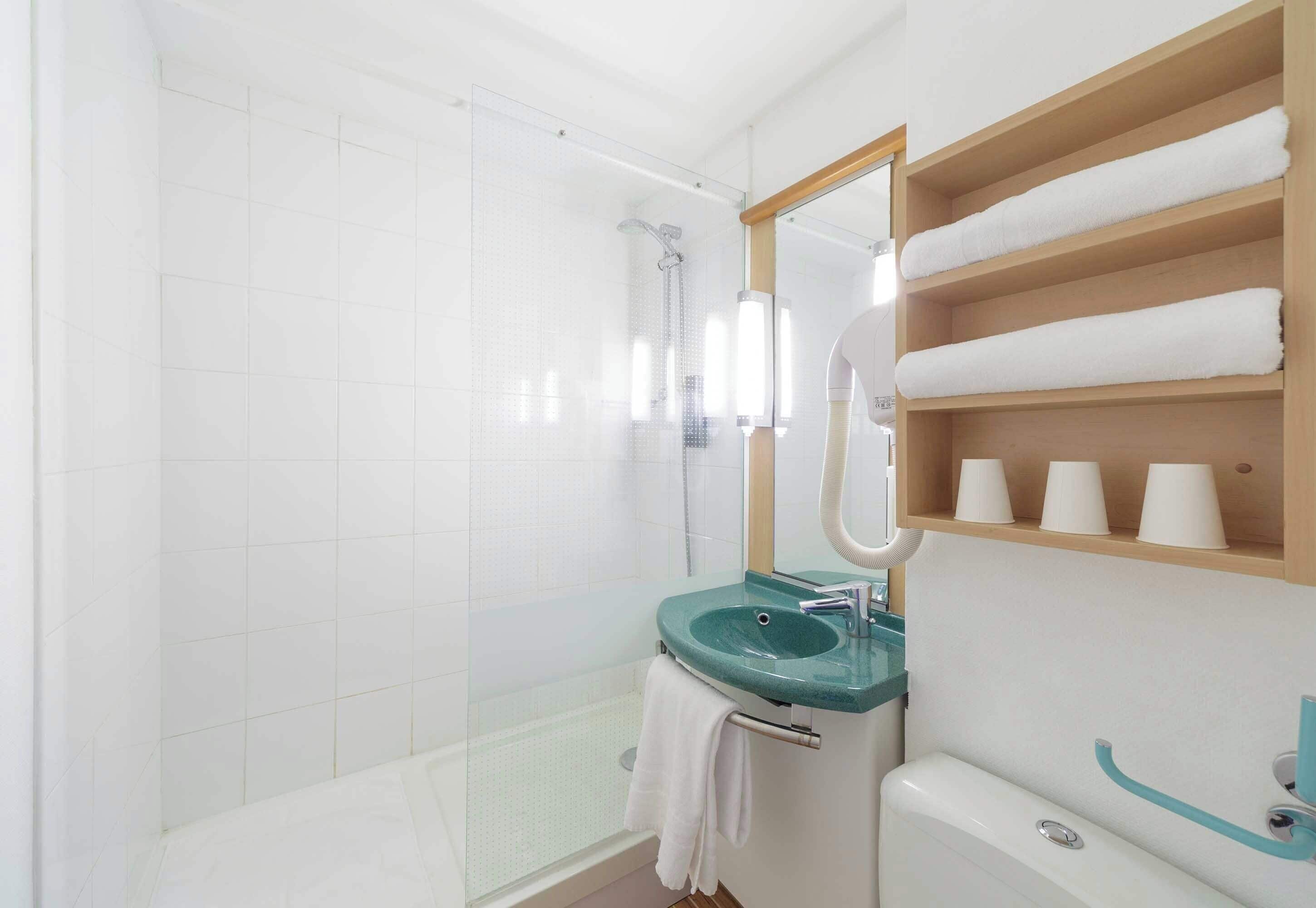 shower, eco-friendly toiletries, hair dryer, towels