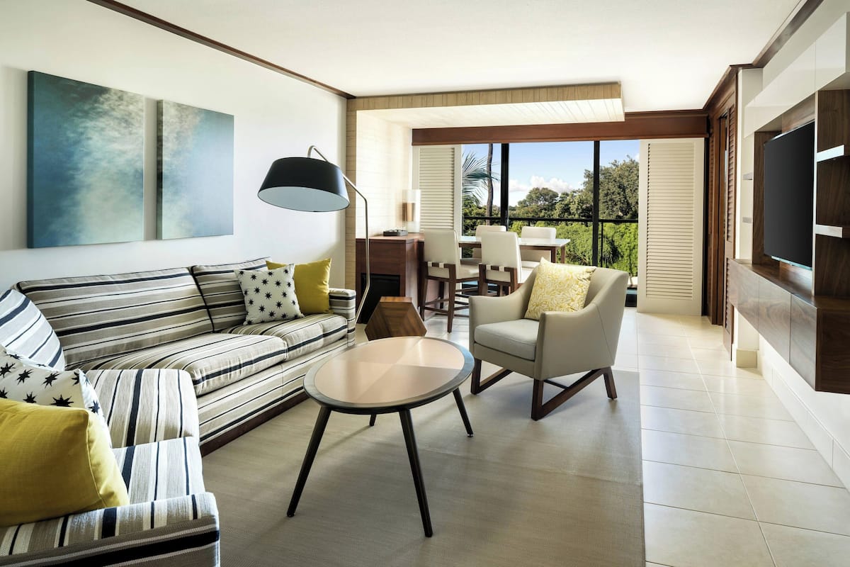 Suite, 1 King Bed with Sofa bed, Balcony, Garden Area | Living room | 55-inch Smart TV with cable channels, TV, Netflix