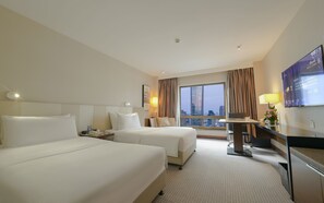 Relax in this stylish room with two large beds, a flat-screen TV, and a desk for work or relaxation.