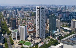 Standing tall in the heart of the city, this high-rise building offers a unique urban perspective.
