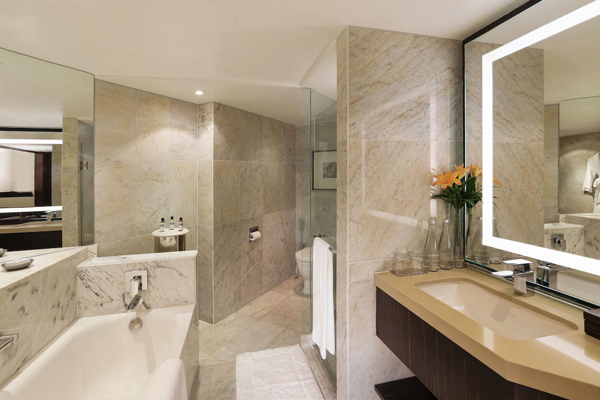 premier suite | bathroom | combined shower/bathtub, hair dryer, bathrobes, slippers