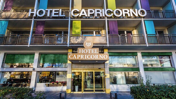 A multi-story hotel with balconies and a prominent sign reading "HOTEL CAPRICORNO". - Hotel Capricorno (Vienna)