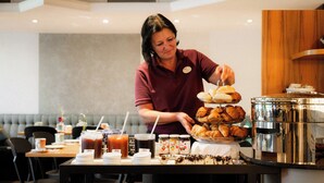 A buffet setup with a variety of food items and beverages. - Hotel Capricorno (Vienna)