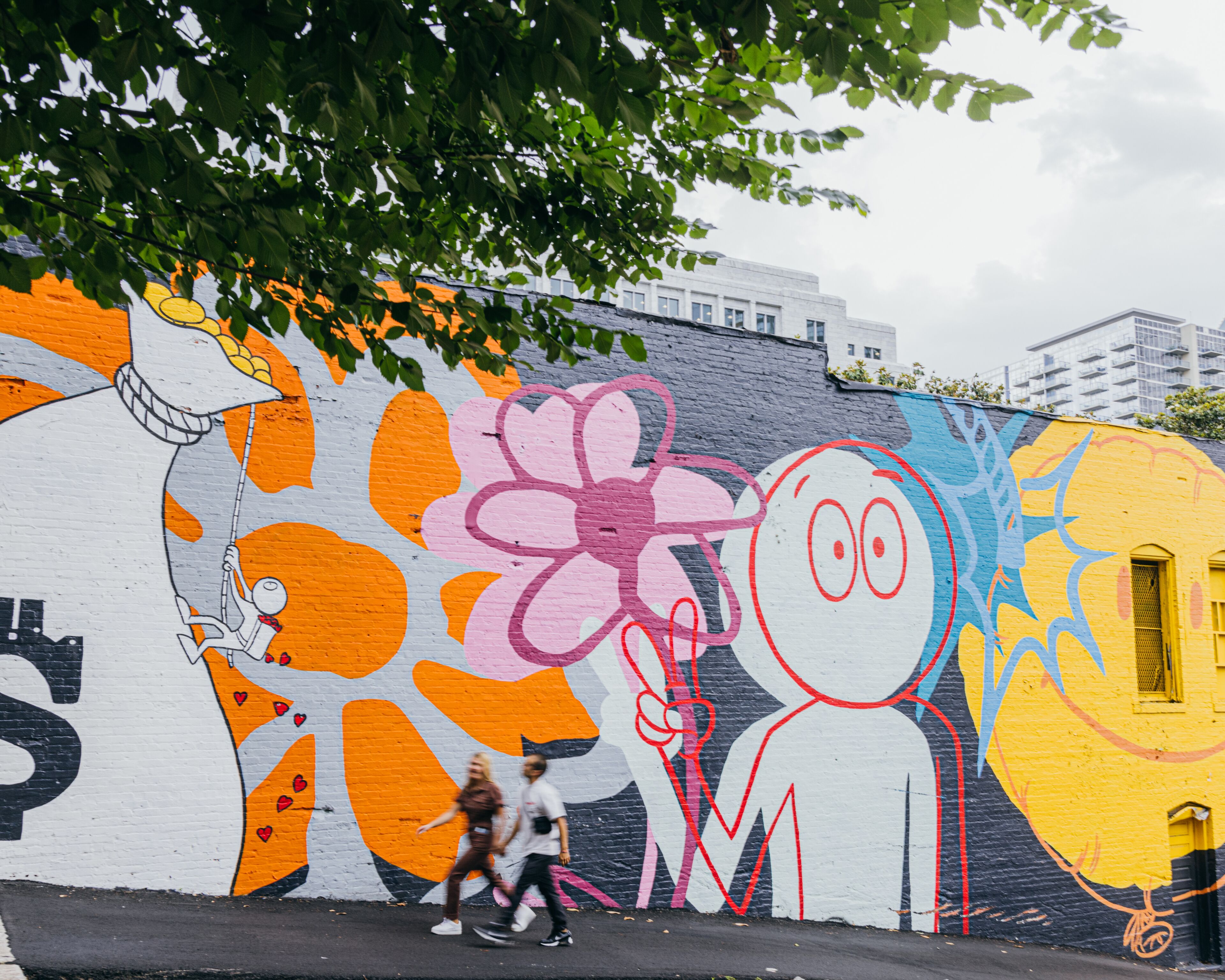 A colorful mural on a building's exterior wall.