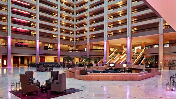 A multi-level hotel lobby with a central seating area, multiple floors, and a staircase. - Renaissance Atlanta Waverly Hotel & Convention Center (Atlanta)