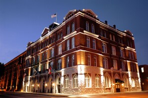 Classic architecture with a symmetrical facade and decorative stonework.