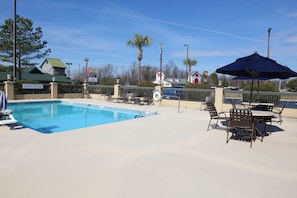 Seasonal outdoor pool, open 10:00 AM to 8:00 PM, sun loungers
