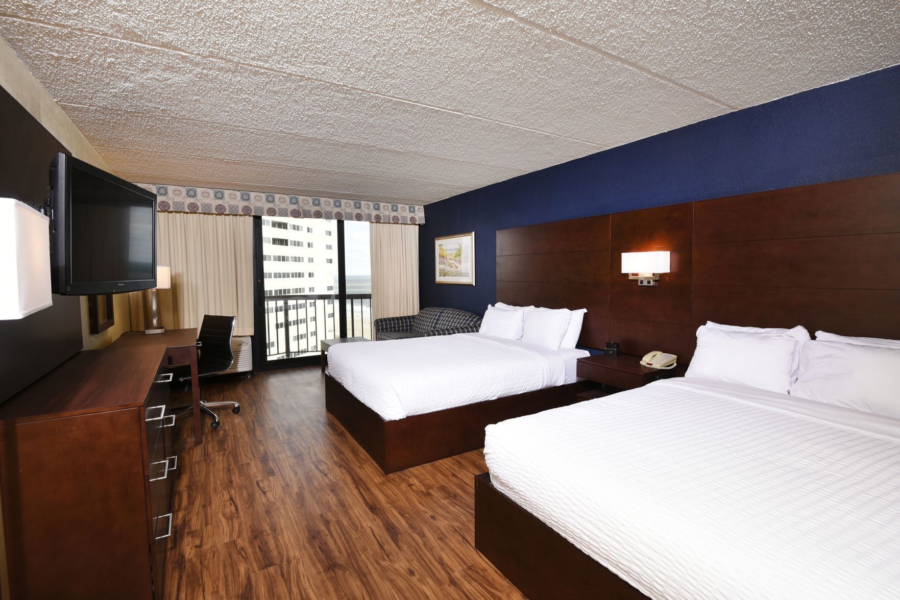 Premium bedding, down duvets, memory-foam beds, in-room safe