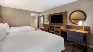 A hotel room with two beds, a desk, a television, a mirror, and a lamp. - Hampton Inn by Hilton Philadelphia / Willow Grove (Willow Grove)