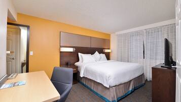 Premium bedding, pillow-top beds, desk, laptop workspace