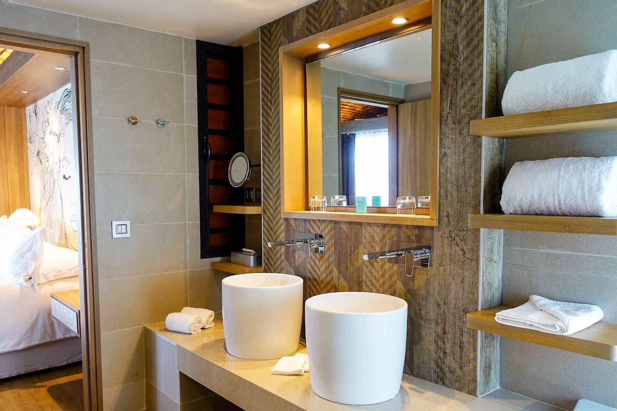 Bungalow, 1 King Bed, Ocean View, Overwater | Bathroom | Designer toiletries, hair dryer, bathrobes, slippers