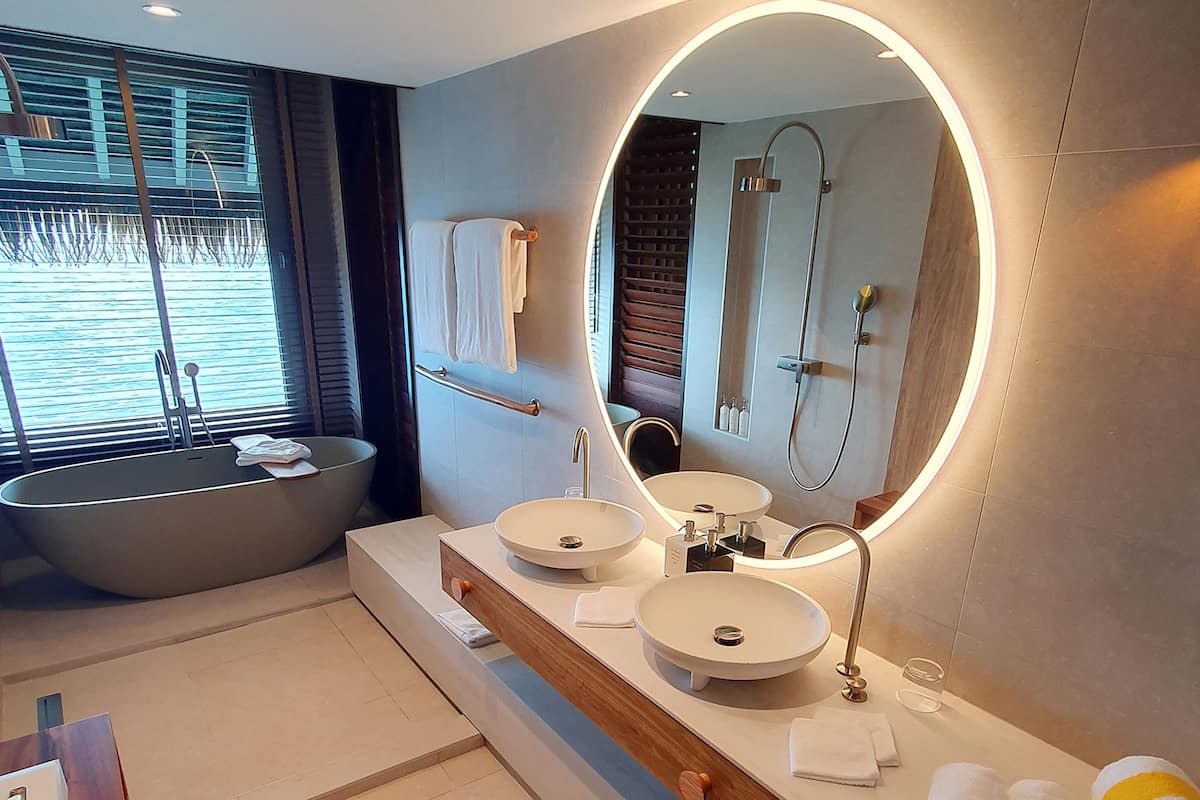 designer toiletries, hair dryer, bathrobes, slippers