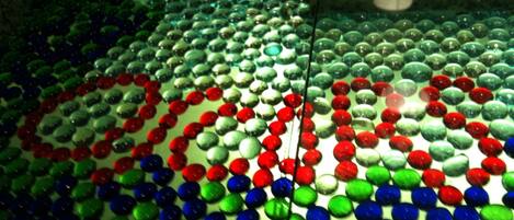 A patterned floor with a series of circular shapes in various colors.