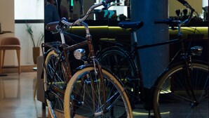 A bicycle parked in front of a bar named "BICICLETA Food Ride" with a neon sign. - Mercure Porto Centro Santa Catarina (Porto)