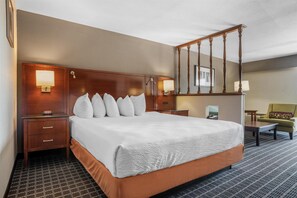 Suite, 1 King Bed, Non Smoking, Balcony (2nd Floor) | Desk, laptop workspace, blackout drapes, iron/ironing board - SureStay Plus Hotel by Best Western Greenwood (Greenwood)