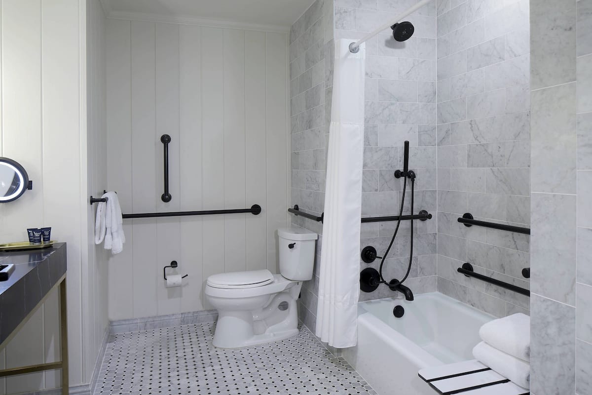 Combined shower/bathtub, designer toiletries, hair dryer, bathrobes