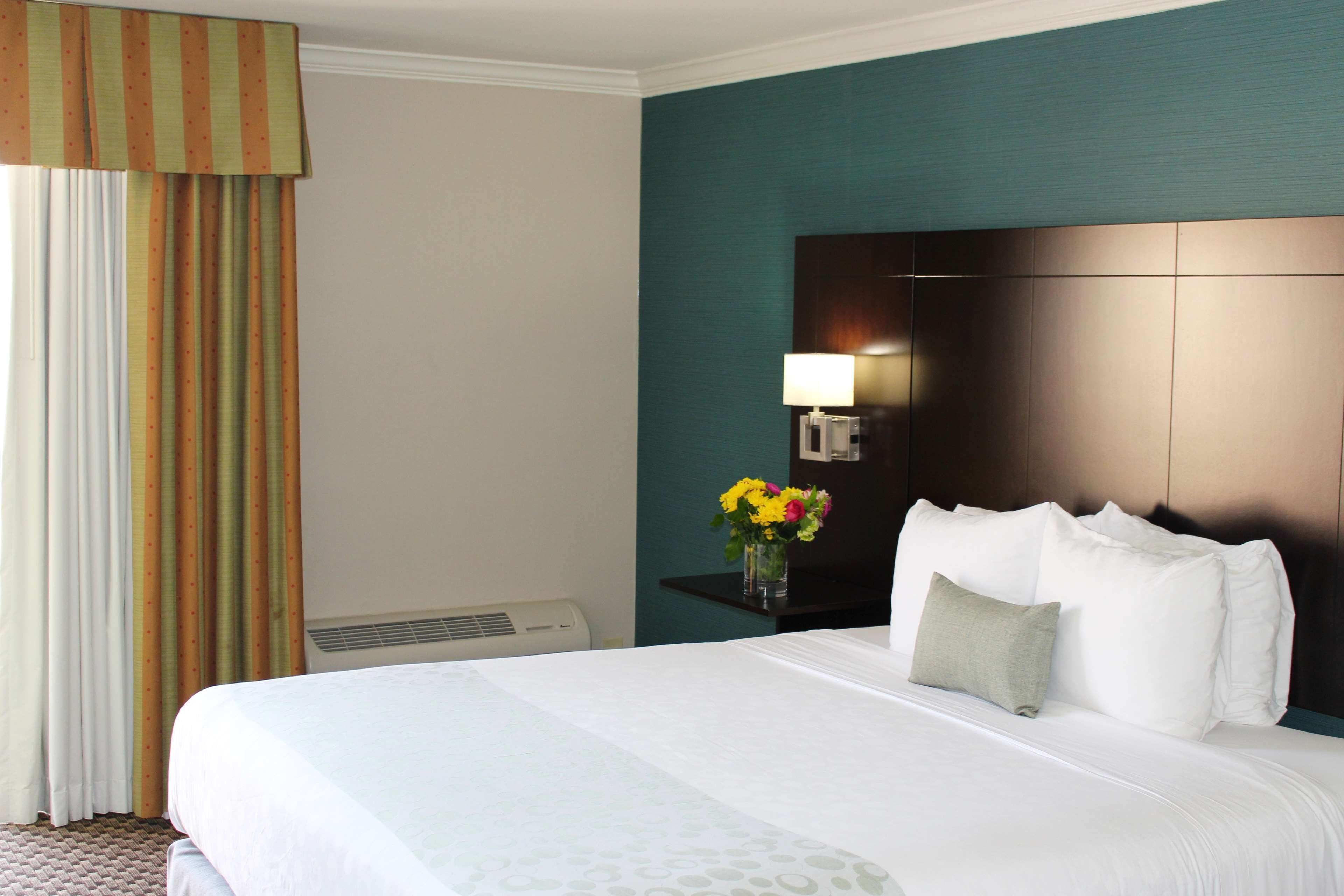 desk, laptop workspace, blackout curtains, iron/ironing board