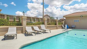 Seasonal outdoor pool, open 3 PM to 10 PM, sun loungers