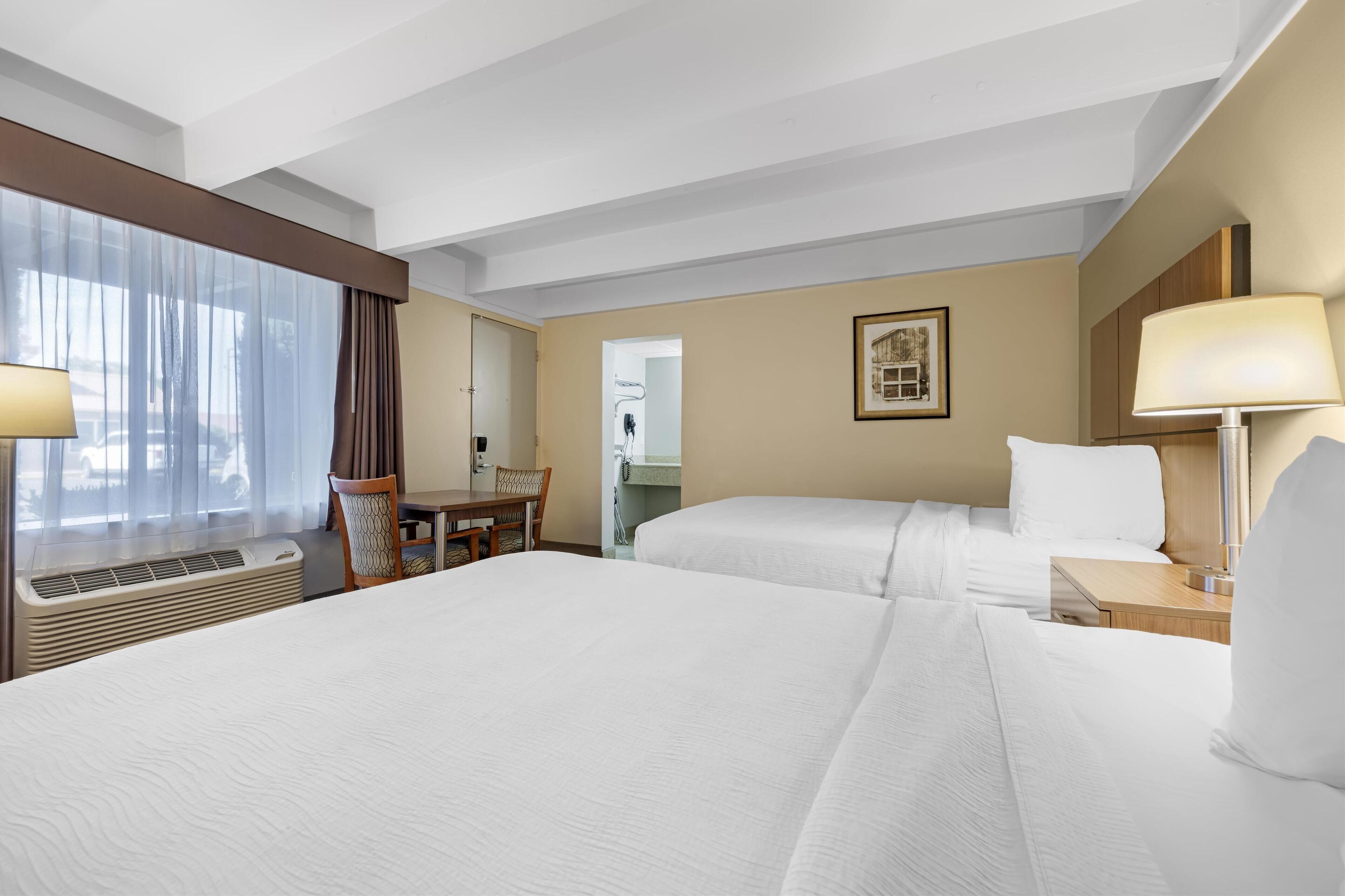 standard room, 2 double beds, non smoking, refrigerator & microwave | premium bedding, desk, blackout curtains, iron/ironing board