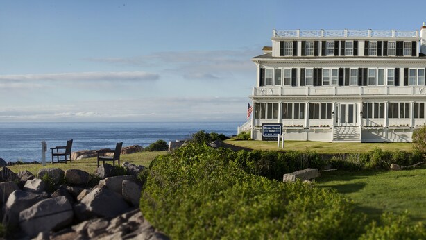A two-story building with a sign reading "Ocean House."