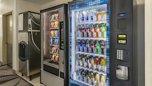 A row of vending machines with snacks and beverages. - Quality Inn Kirksville (Kirksville)
