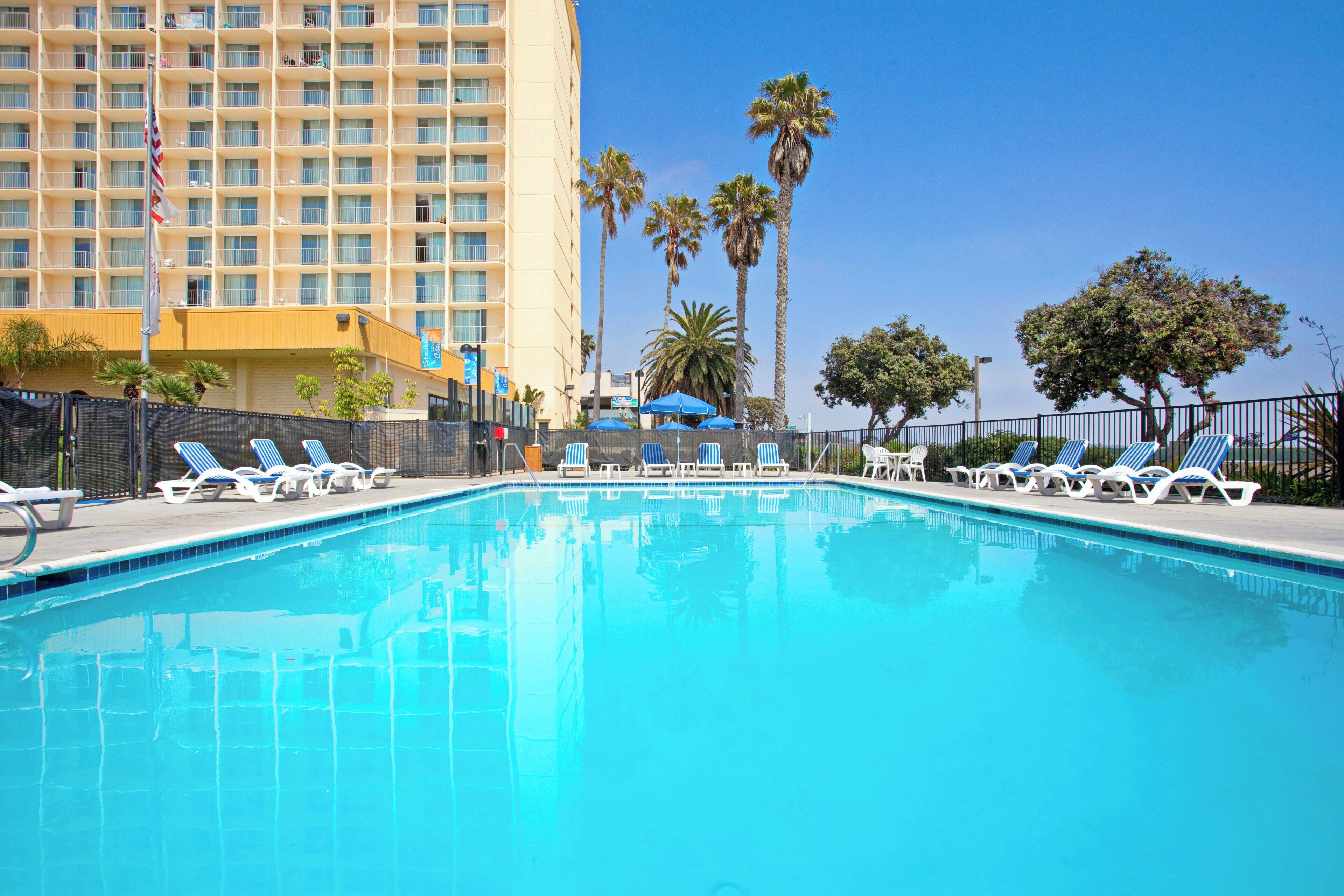 Outdoor pool, open 9:00 AM to 10:00 PM, pool umbrellas, pool loungers