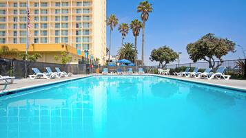 Outdoor pool, open 9:00 AM to 10:00 PM, pool umbrellas, pool loungers