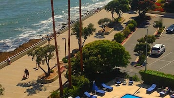 Outdoor pool, open 9:00 AM to 10:00 PM, pool umbrellas, pool loungers