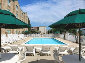 Seasonal outdoor pool, open 9 AM to 9 PM, pool umbrellas, pool loungers