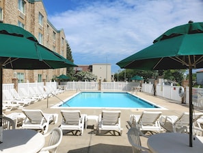 Seasonal outdoor pool, open 9 AM to 9 PM, pool umbrellas, pool loungers