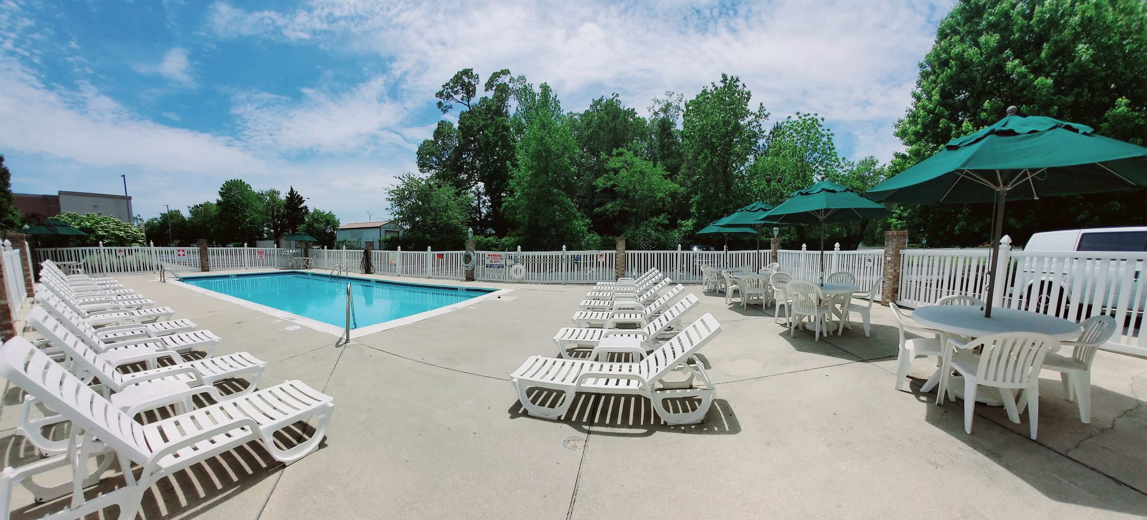seasonal outdoor pool, open 9 am to 9 pm, pool umbrellas, pool loungers
