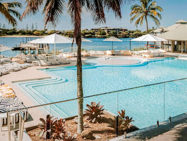 Outdoor pool, pool umbrellas, sun loungers