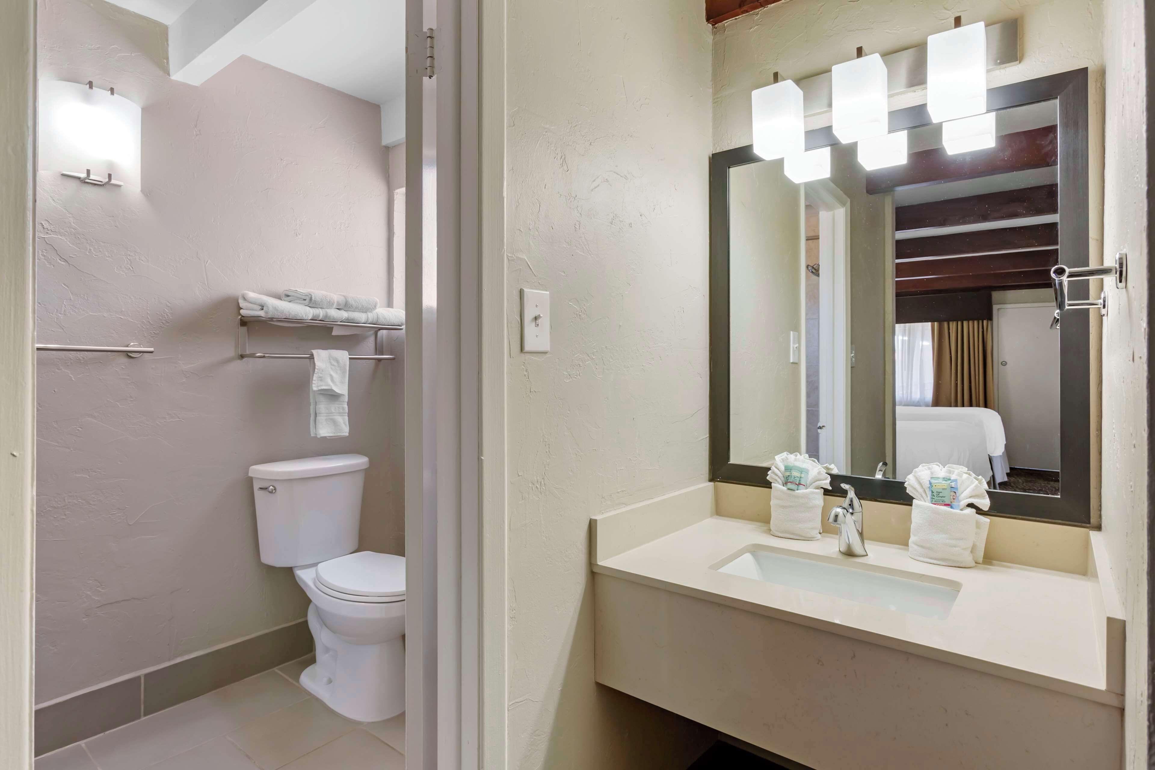 suite, 2 queen beds, non smoking, refrigerator & microwave | bathroom | combined shower/bathtub, free toiletries, hair dryer, towels