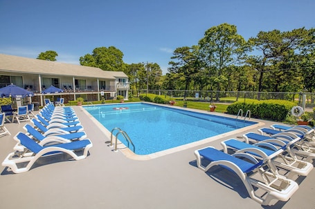 Seasonal outdoor pool, open 9 AM to 8:00 PM, pool umbrellas. Blue Rock Resort