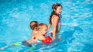 Two children in a swimming pool.