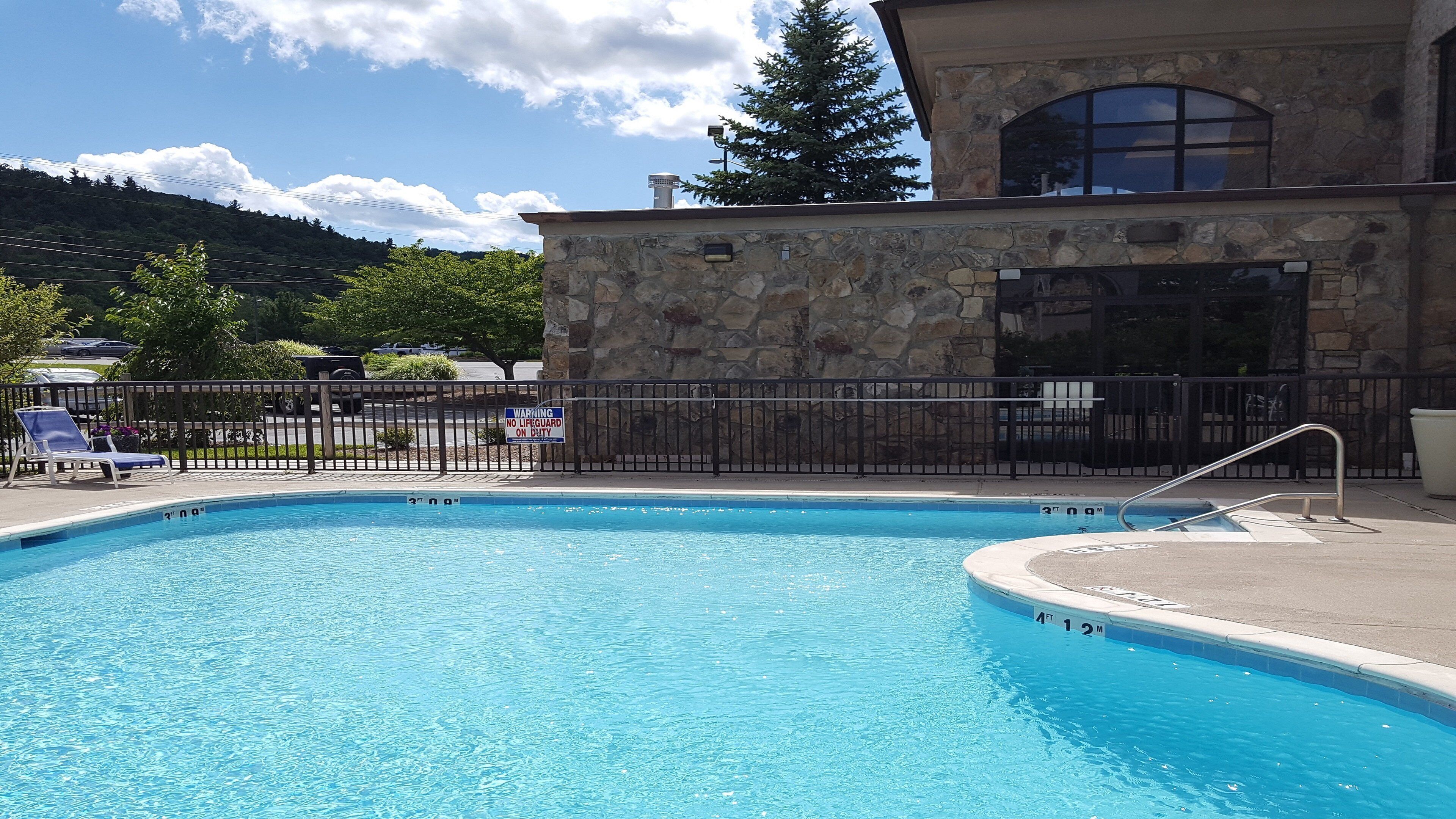 Seasonal outdoor pool, pool loungers