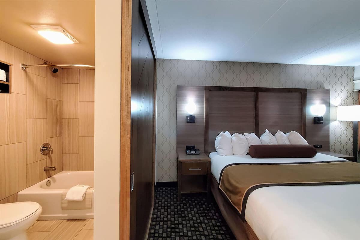 SuĆte executiva, 1 cama King, para nĆ£o fumantes | Cofres nos quartos, ferros/tĆ”buas de passar roupa