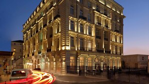 A multi-story hotel with classical architecture, featuring balconies and ornate detailing. - Pera Palace Hotel (Istanbul)