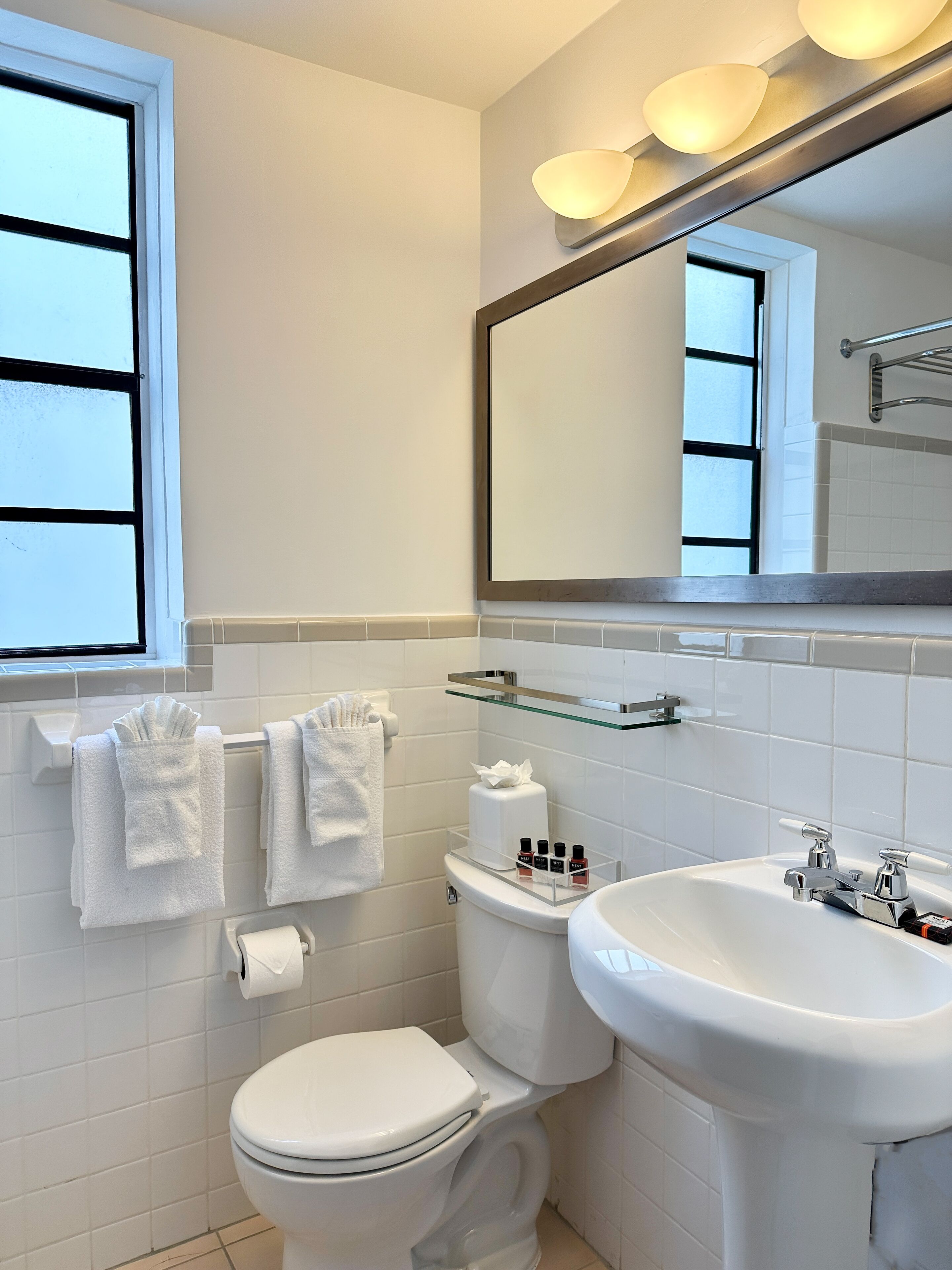 designer toiletries, hair dryer, bathrobes, slippers