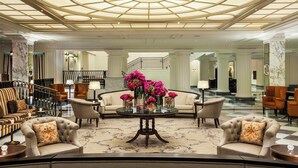 A spacious lobby with a grand staircase, elegant seating, and a decorative glass ceiling. - InterContinental New York Barclay by IHG (New York)