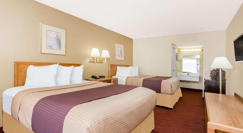 Pillowtop beds, desk, blackout drapes, iron/ironing board