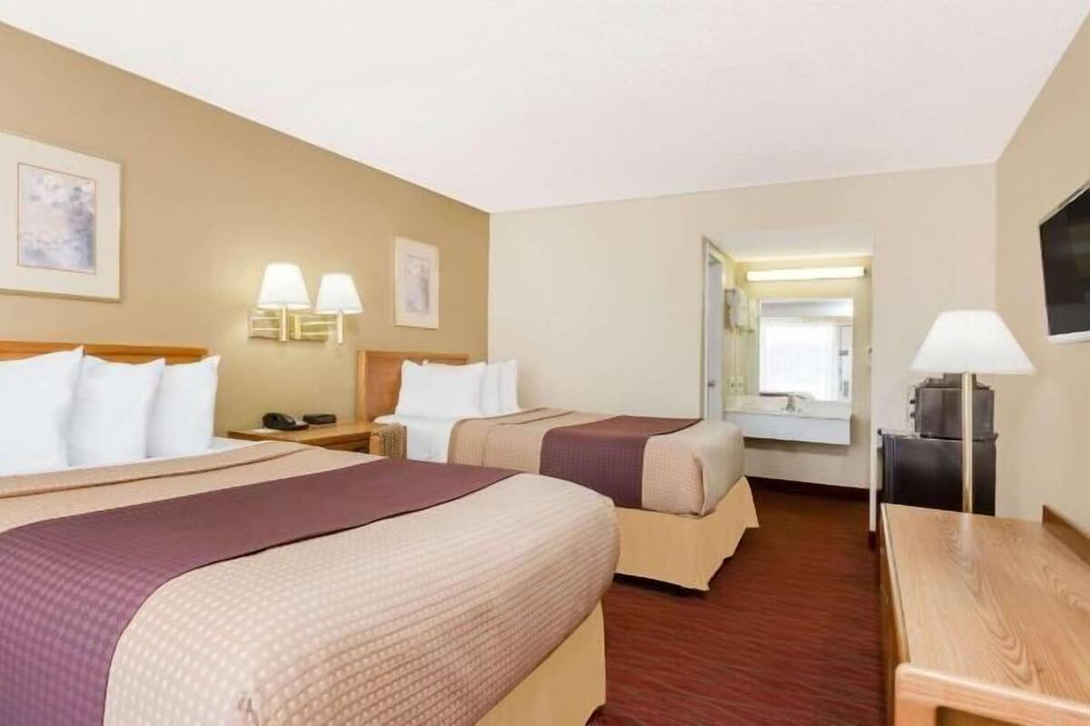 Pillowtop beds, desk, blackout drapes, iron/ironing board