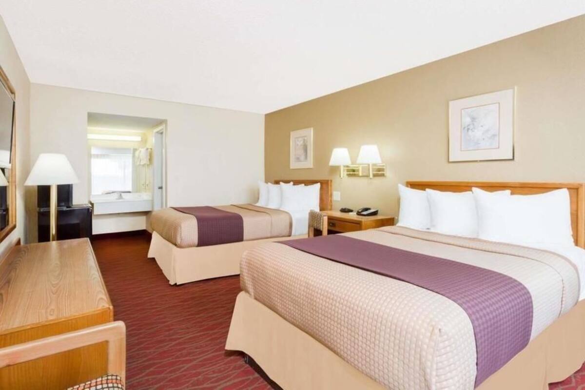 Pillowtop beds, desk, blackout drapes, iron/ironing board