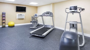 A fitness room with treadmills, a stationary bike, and exercise balls. - Days Inn by Wyndham Staunton (Staunton)