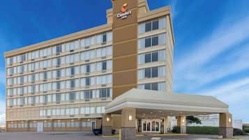 Experience the sleek, modern design of this hotel, featuring a striking vertical section and a beautifully symmetrical facade.