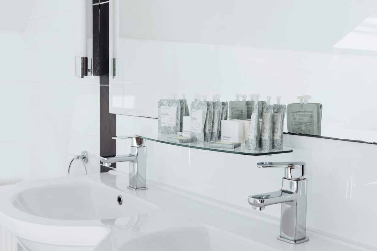 family quadruple room | bathroom | deep-soaking bathtub, hair dryer, soap, shampoo