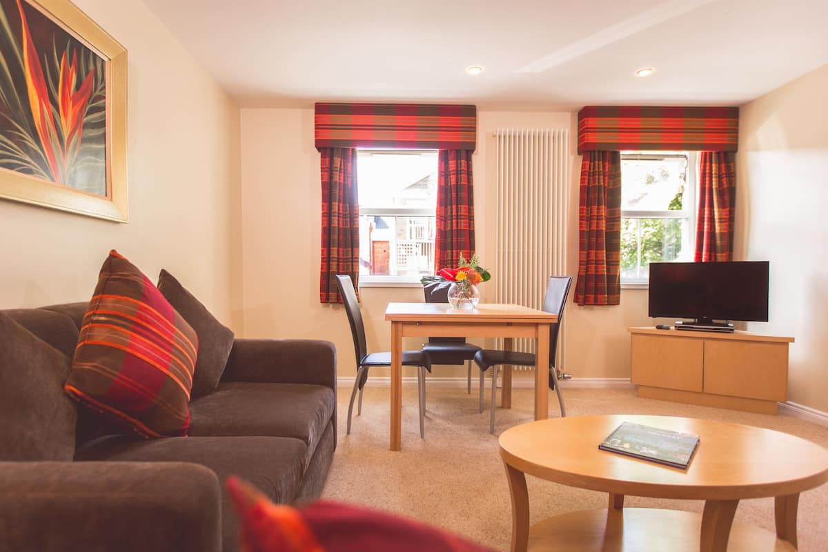 Residences One Bedroom Apartment (annex building) | Living area | TV