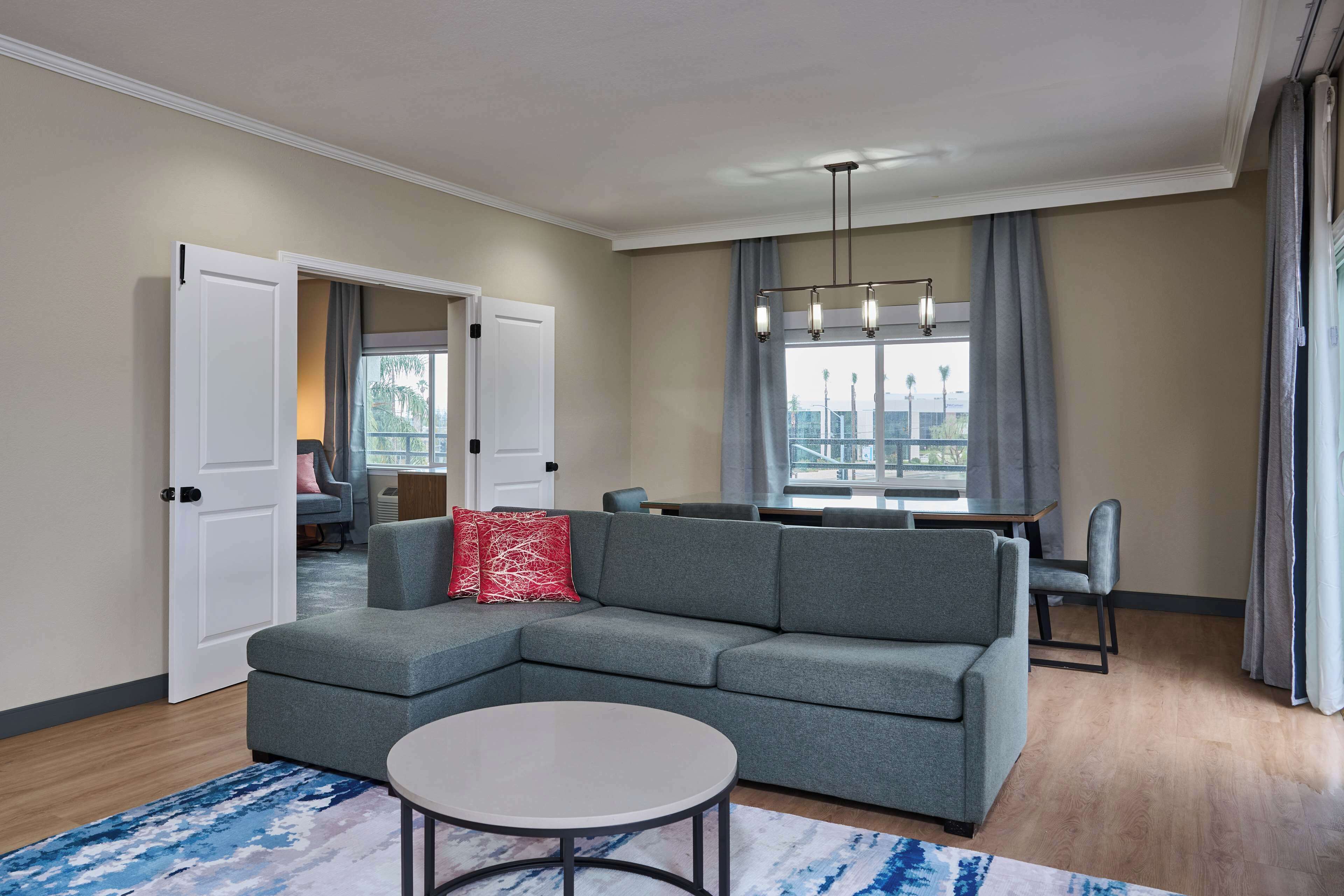 Suite, 1 King Bed | Living area | 55-inch Smart TV with cable channels, Netflix, streaming services